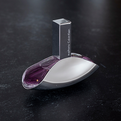 CALVIN KLEIN<sup>&reg;</sup> Euphoria Perfume for Women - The beautiful fragrance starts off with pomegranate, persimmon, and a lovely lush green accord. The heart then blends into a sensual lotus blossom, black orchid which then finishes off with amber, violet, cream and woods. Spray bottle contains 1.6 fl oz of perfume.